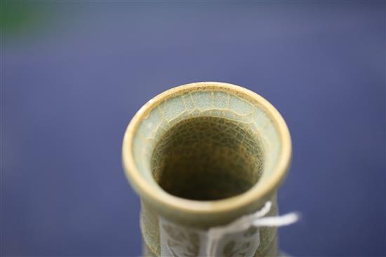 A Chinese celadon bottle vase, H. 15.4cm